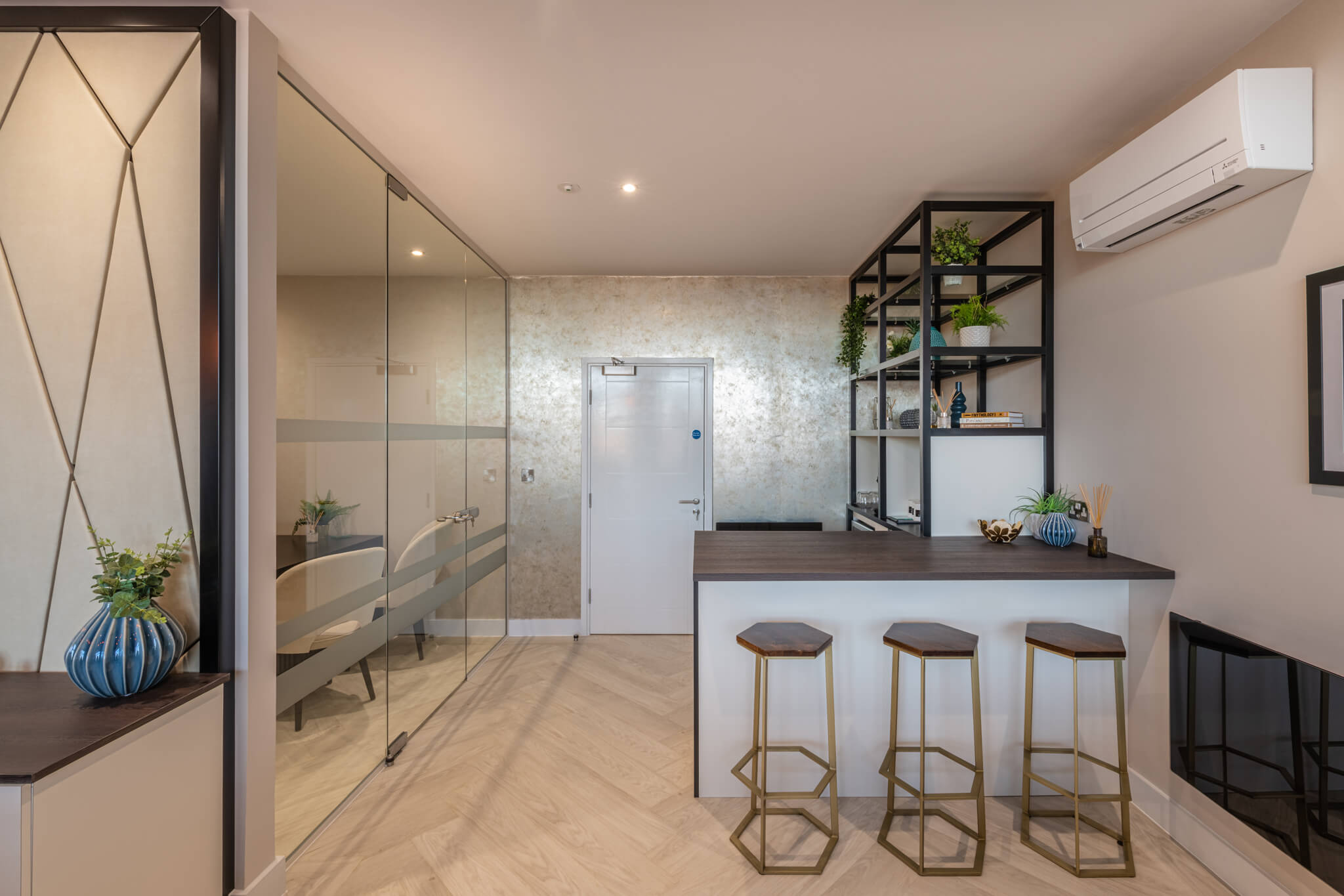 meeting room with a large glass door and a seating area outside it