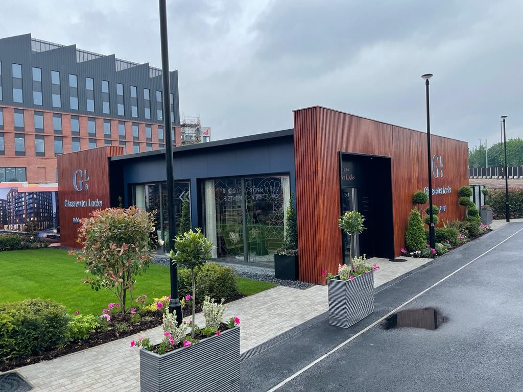 Large marketing suite with wooden detailing and large floor to ceiling windows